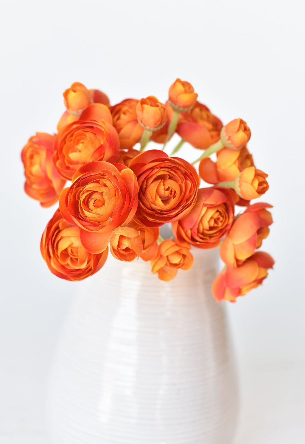 10.5" Faux Peachy Orange Ranunculus Stem Bundle