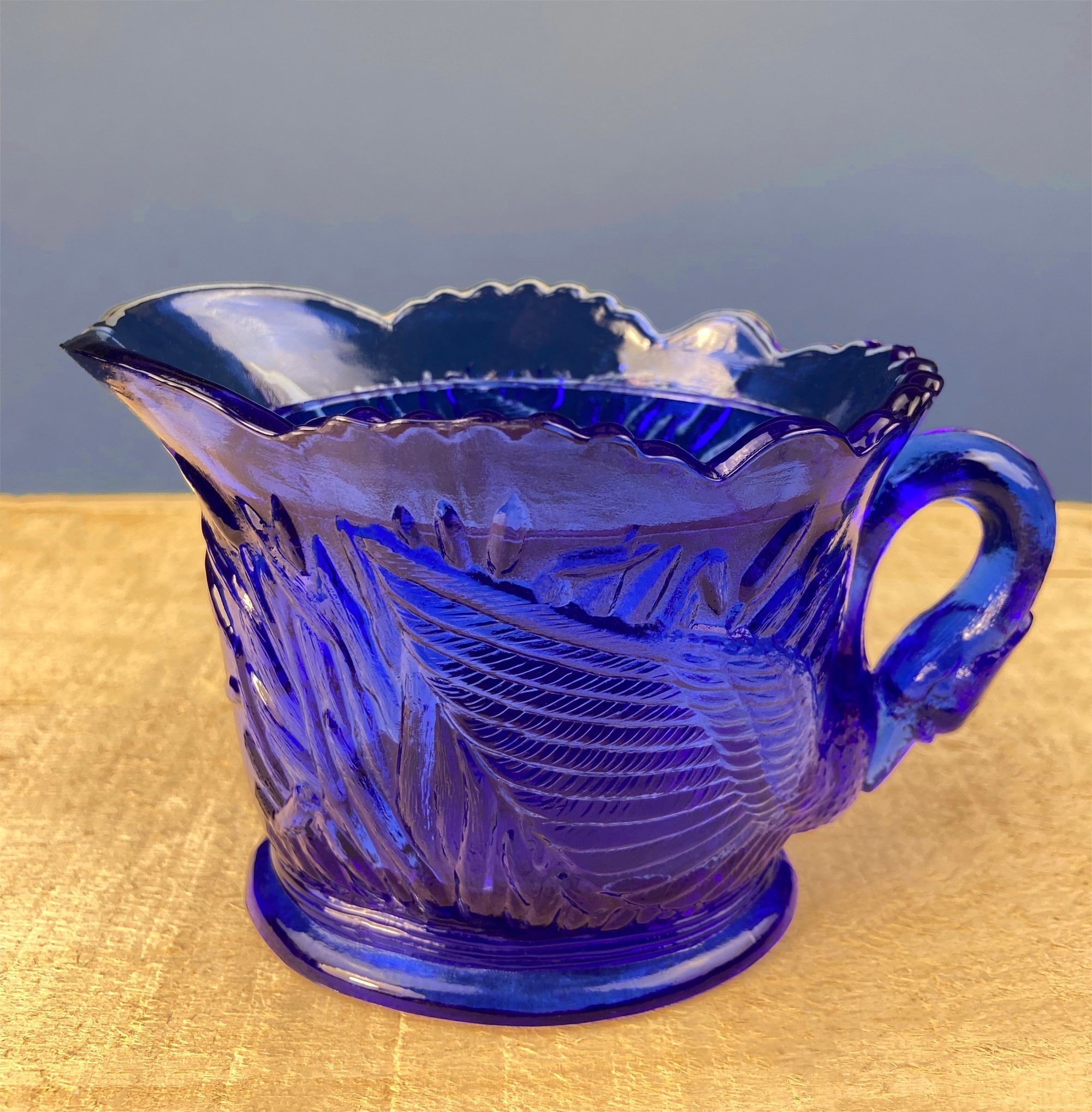 Cobalt Blue Glass Creamer with Swan Handle & Embossed Reed Design