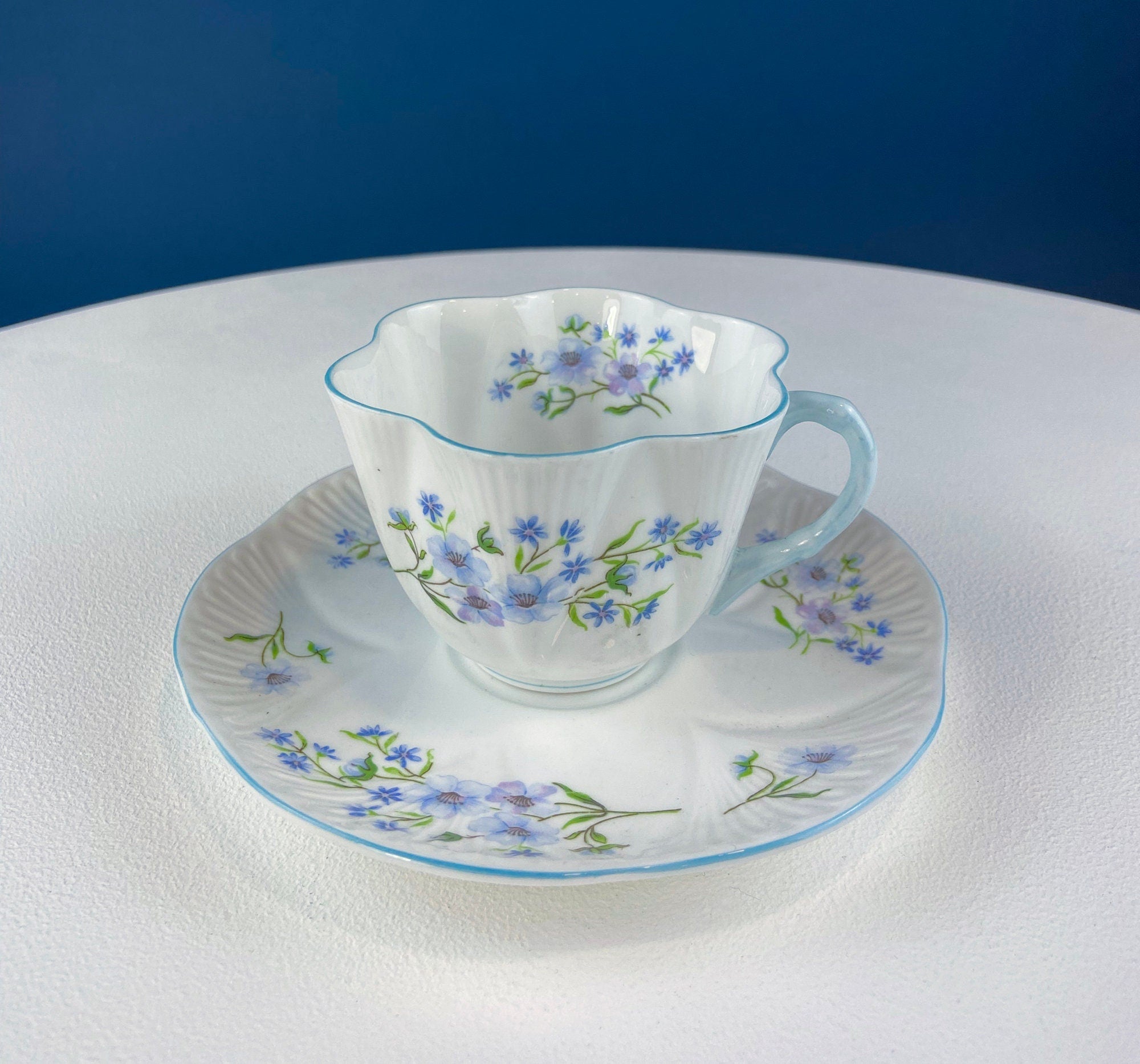 Antique Shelley Tea Cup & Saucer – Begonia Motif with Blue Handle