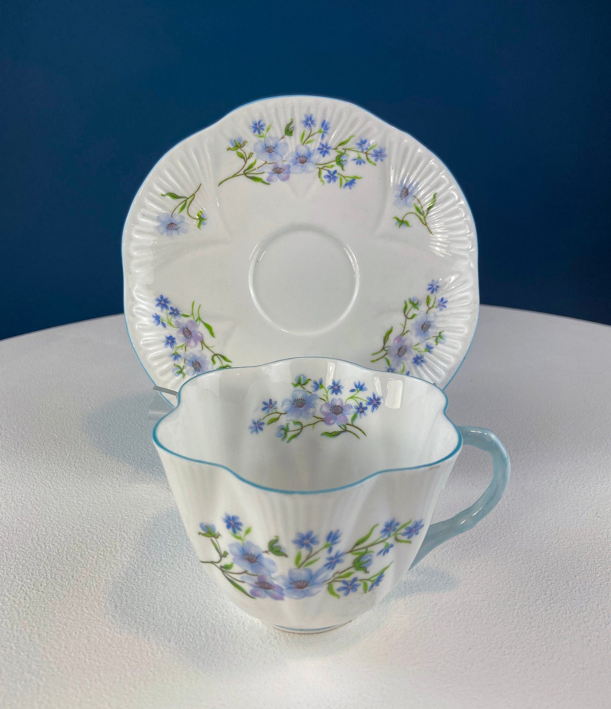 Antique Shelley Tea Cup & Saucer – Begonia Motif with Blue Handle